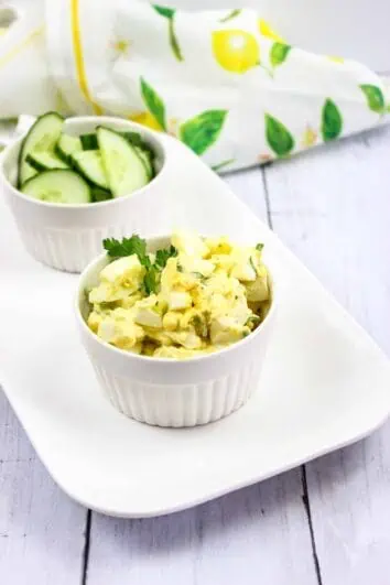 The Best Keto Egg Salad recipe on a plate with cucumbers