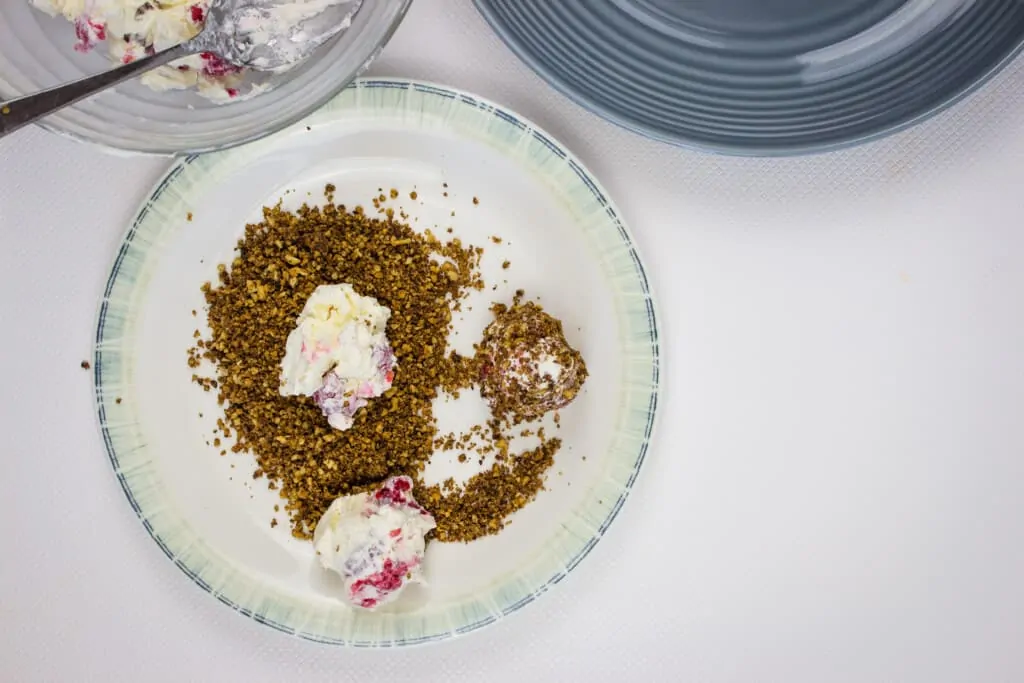 drop balls into ground toasted pecans and roll into balls