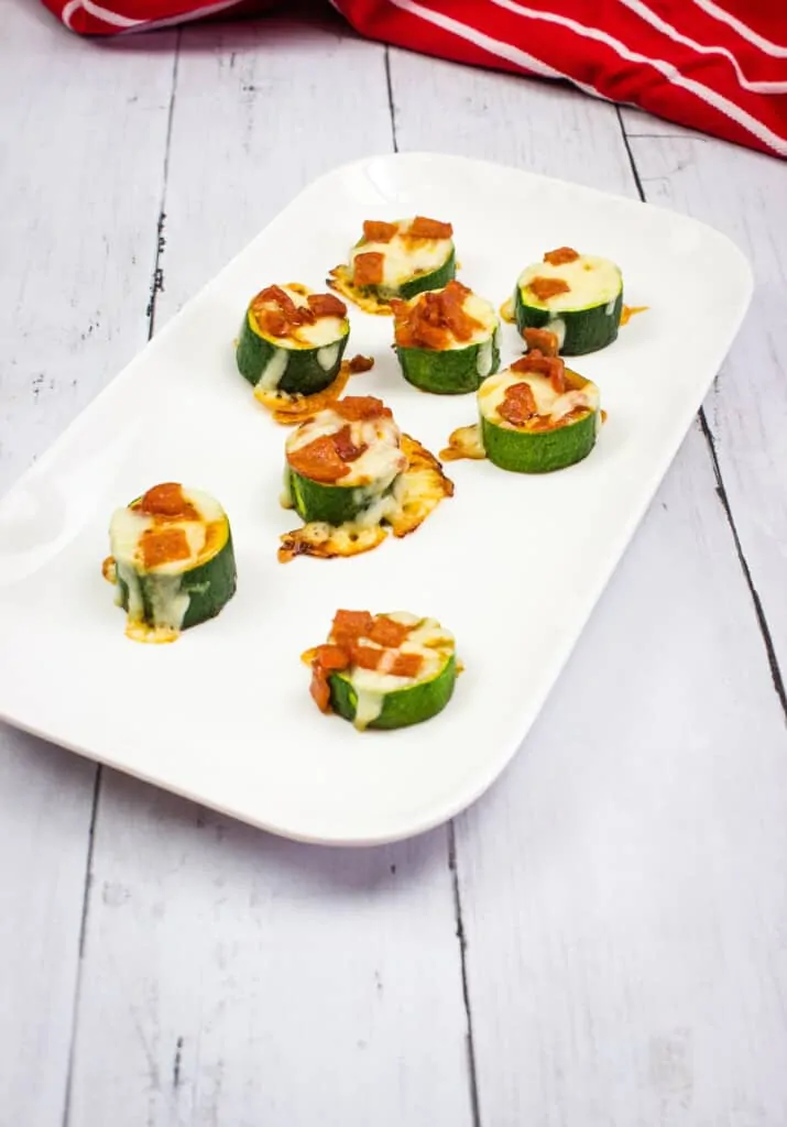 Zucchini pizza bites on a rectangular platter