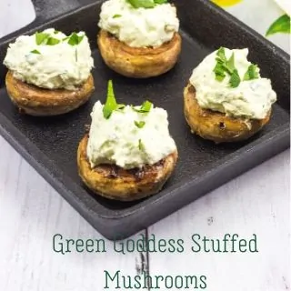 keto green goddess stuffed mushrooms in a black cast iron pan