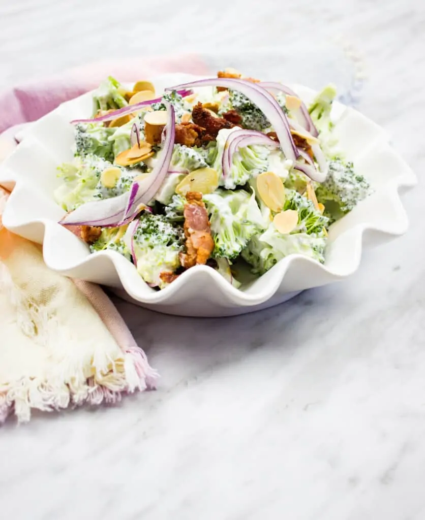 keto broccoli salad with bacon in a white serving bowl