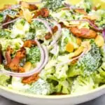 keto broccoli salad with bacon in a yellow bowl