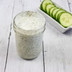 Ranch Dressing in a jar with cucumbers in the background, for keto cobb salad