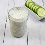 Ranch Dressing in a jar with cucumbers in the background, for keto cobb salad