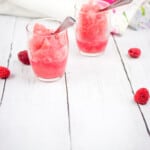 frozen raspberry vodka slushes in glasses with spoons