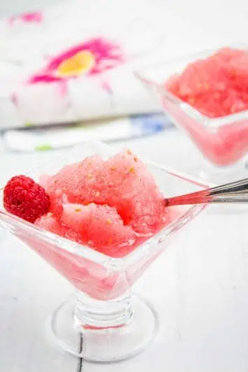 frozen raspberry vodka slush in glasses with a spoon