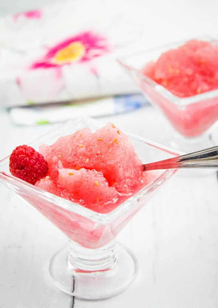 frozen raspberry vodka slush in glasses with a spoon