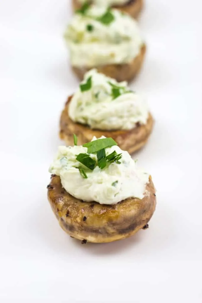 green goddess stuffed mushrooms on a plate
