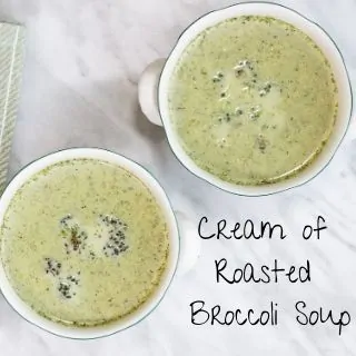 keto cream of roasted broccoli soup in two serving bowls