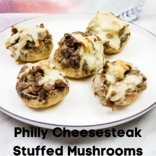 philly cheesesteak stuffed mushrooms on a serving dish