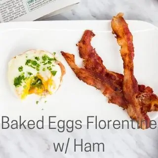 baked eggs florentine with ham on a plate with bacon