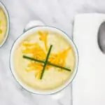 keto broccoli cheese soup in two bowls with spoons