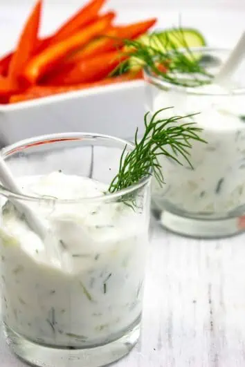 tzatziki sauce keto in glass dishes with veggies in the back