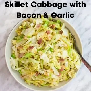 skillet cabbage with bacon and garlic in a serving bowl