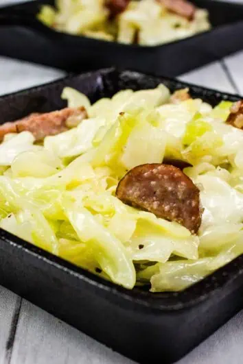 keto cabbage and sausage side dish in a square skillet
