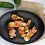 keto jalapeno ranch poppers on a black oval dish