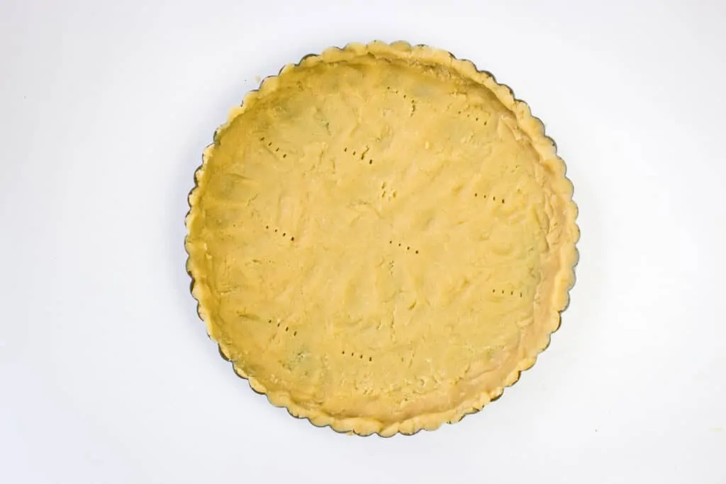 press keto pie dough into a pie or tart pan