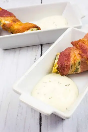 ranch keto jalapeno poppers on a serving dish with sauce