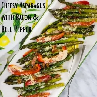 cheesy baked asparagus on a rectangular platter