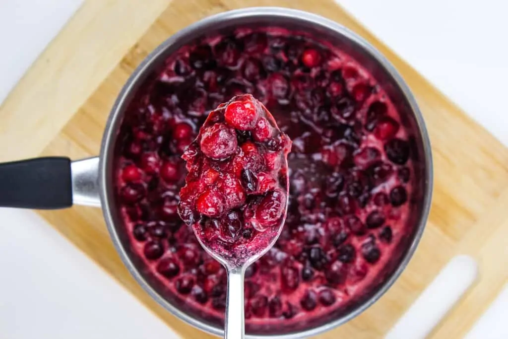 cook keto cranberry sauce until most berries pop