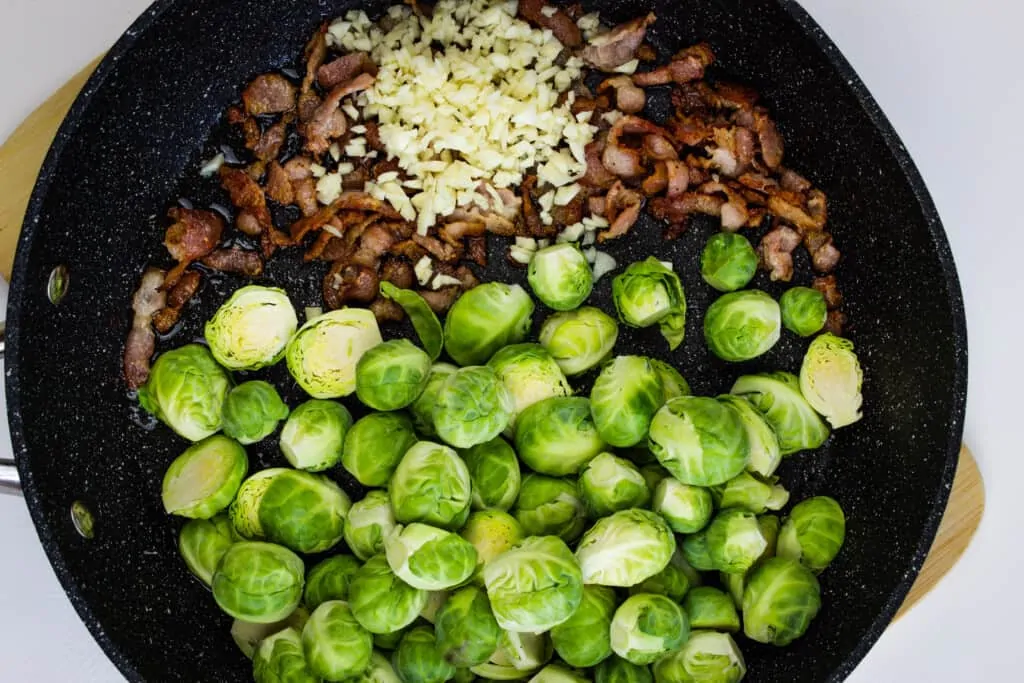 add brussels sprouts to bacon fat and cook in skillet