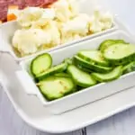 keto pickles on a tray with cauliflower, salami, and cheese