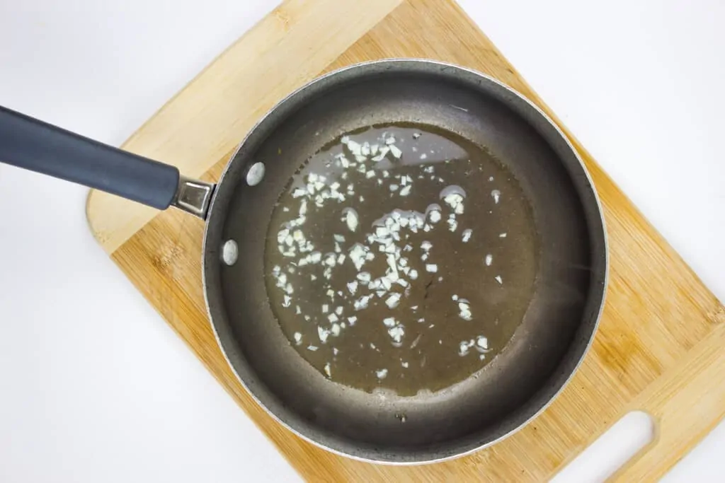 reduce the chicken stock and add the garlic