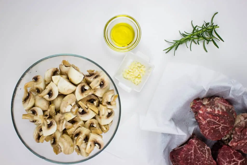 prepped ingredients to make keto beef tenderloin steaks with mushrooms