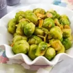 keto brussels sprouts with almonds & brown butter in a serving dish