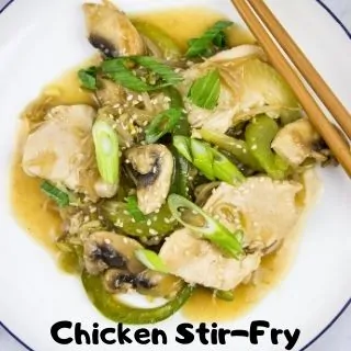 Chicken stir fry in a bowl with chopsticks