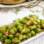 keto brussels sprouts with almonds & brown butter in a serving dish