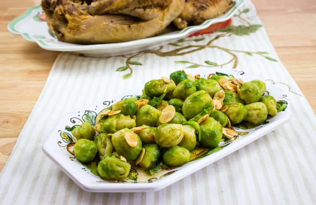 brussels sprouts with almonds and brown butter in a serving dish