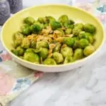 keto brussels sprouts with almonds & brown butter in a serving dish