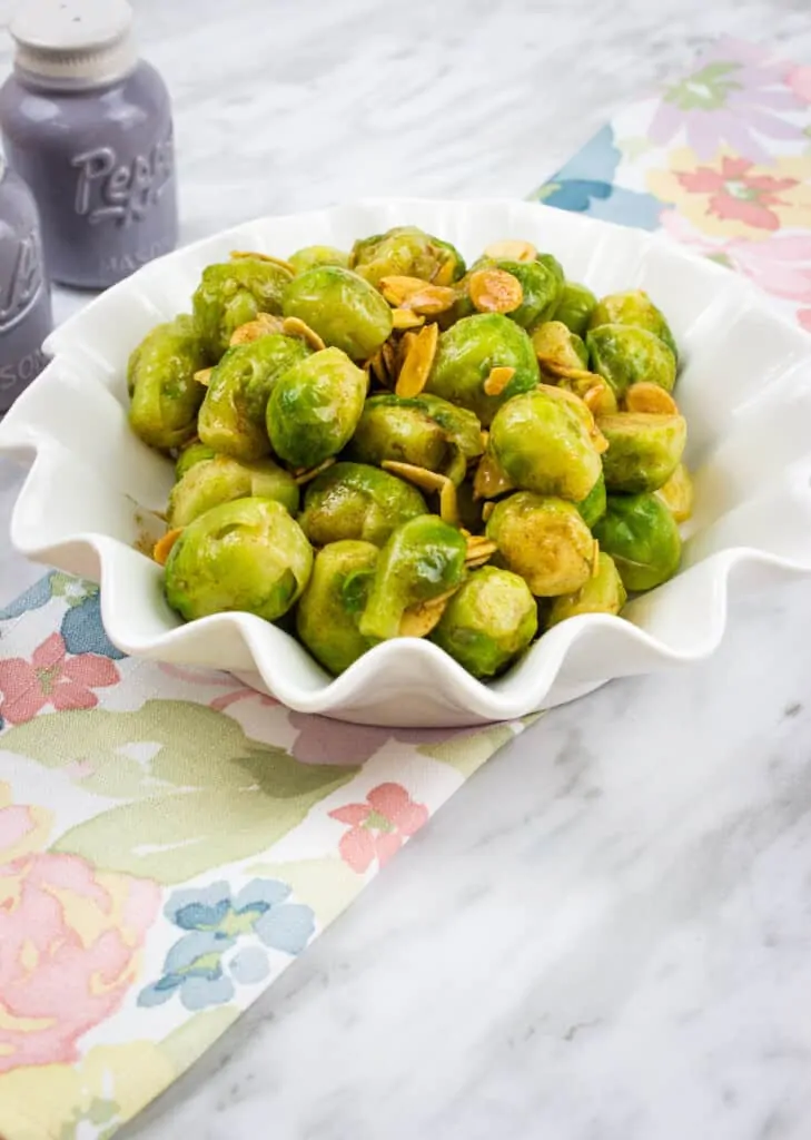 keto brussels sprouts with almonds and brown butter in a serving dish