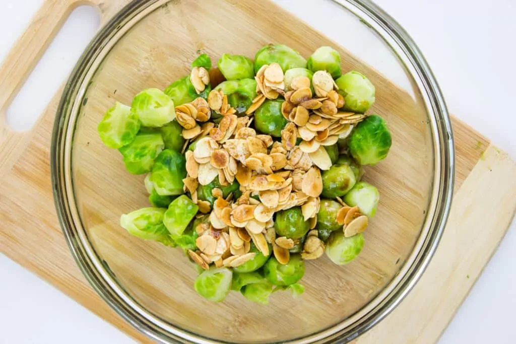 toss almonds and brown butter with sprouts