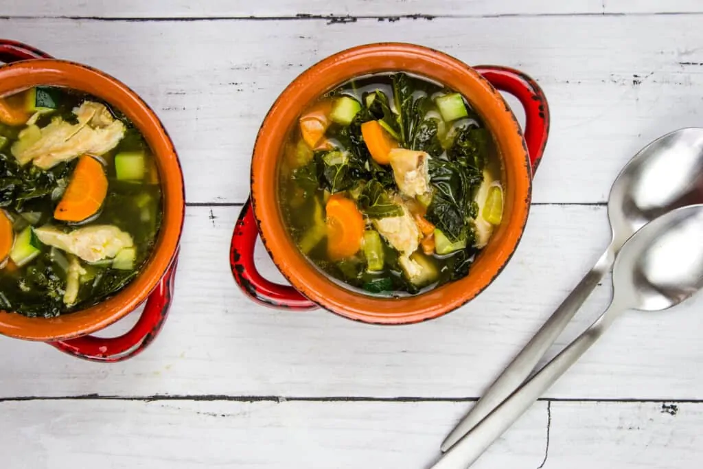 keto leftover turkey vegetable soup in bowls with spoons