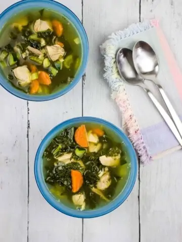 keto leftover turkey vegetable soup in bowls with spoons