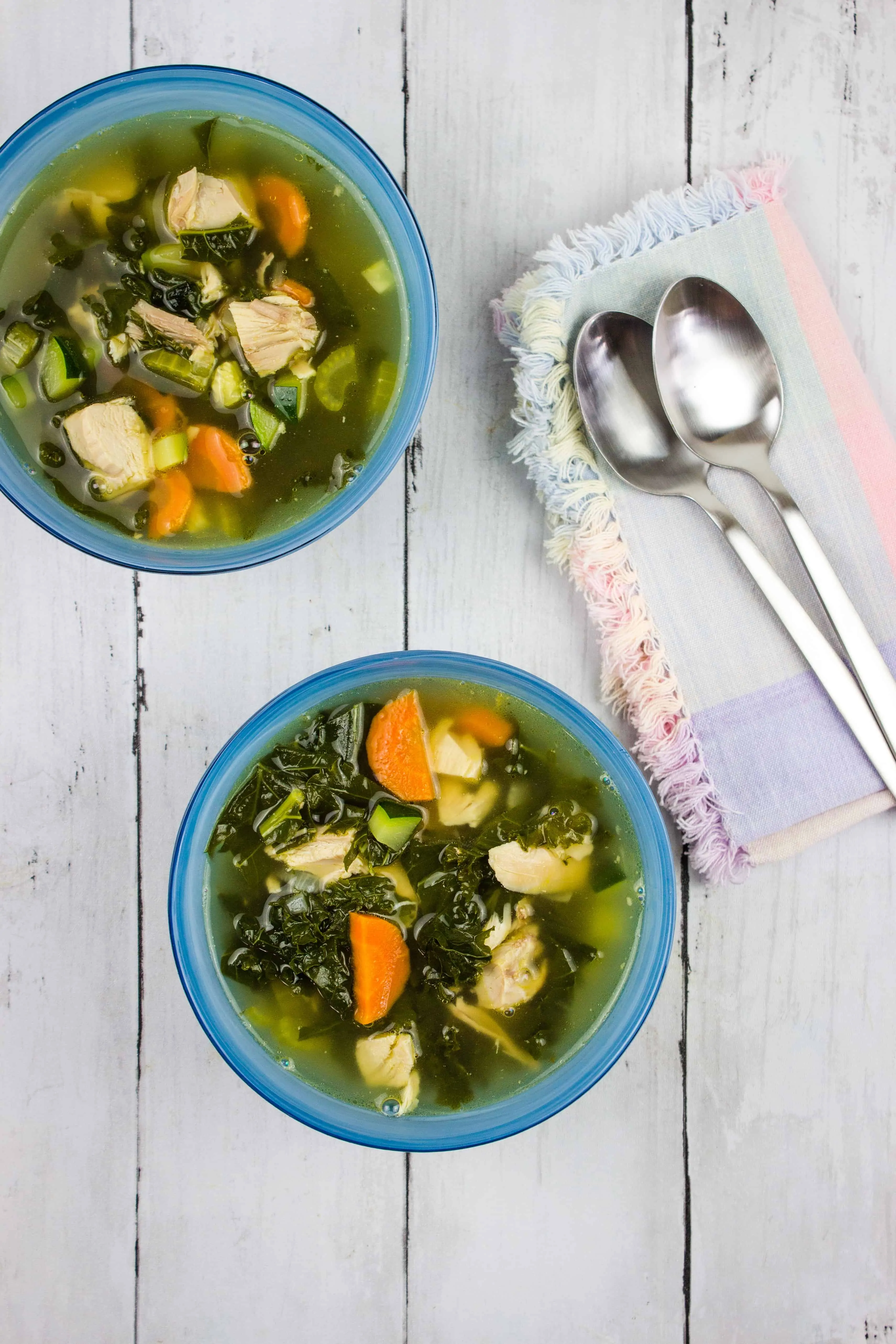 keto leftover turkey vegetable soup in bowls with spoons