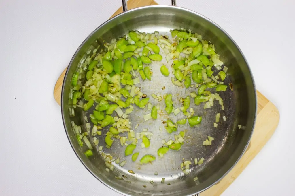 sautee the onions and celery in a soup pot