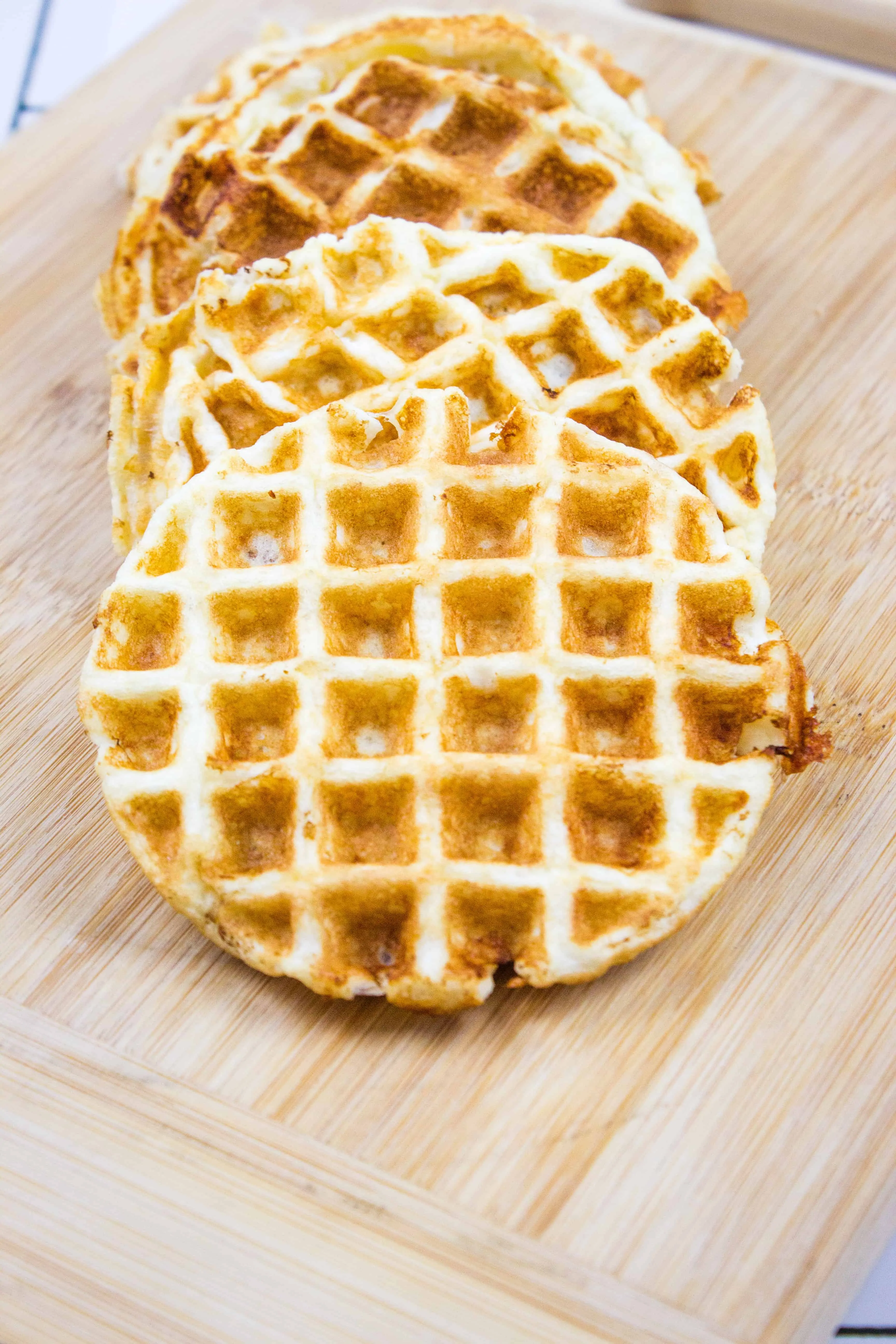 keto chaffle recipe with cooked chaffles on a cutting board