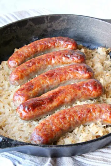 keto sauerkraut and sausage in a cast iron baking dish