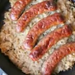 keto one dish sausage and sauerkraut in a black dish