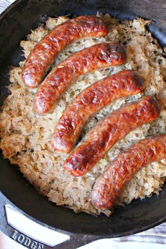 keto one dish sausage and sauerkraut in a black dish