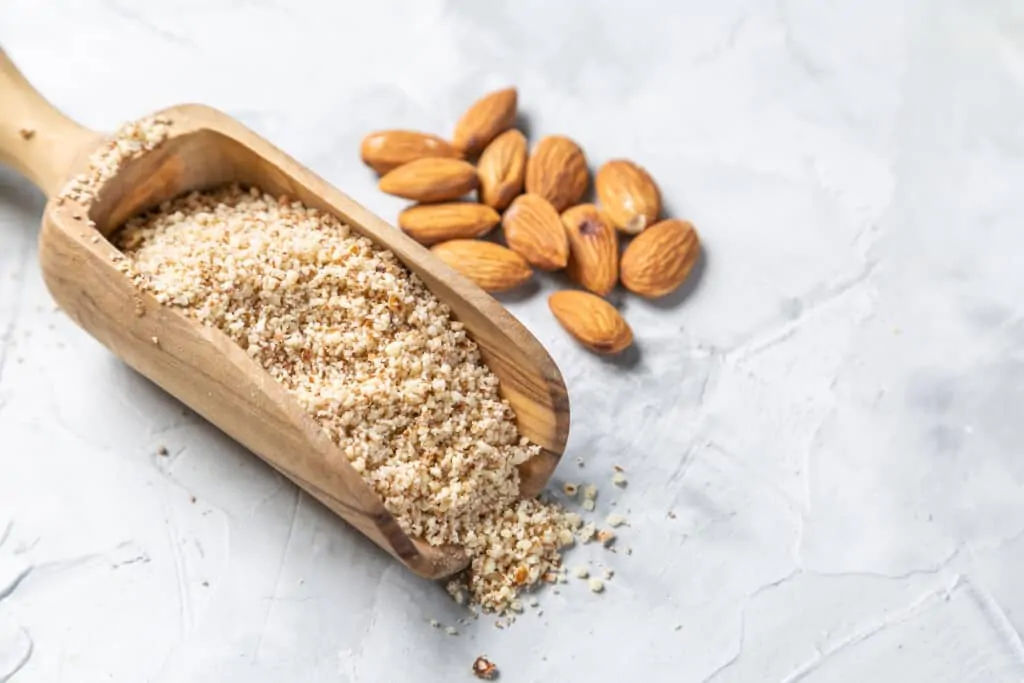 almonds and almond flour on a spoon