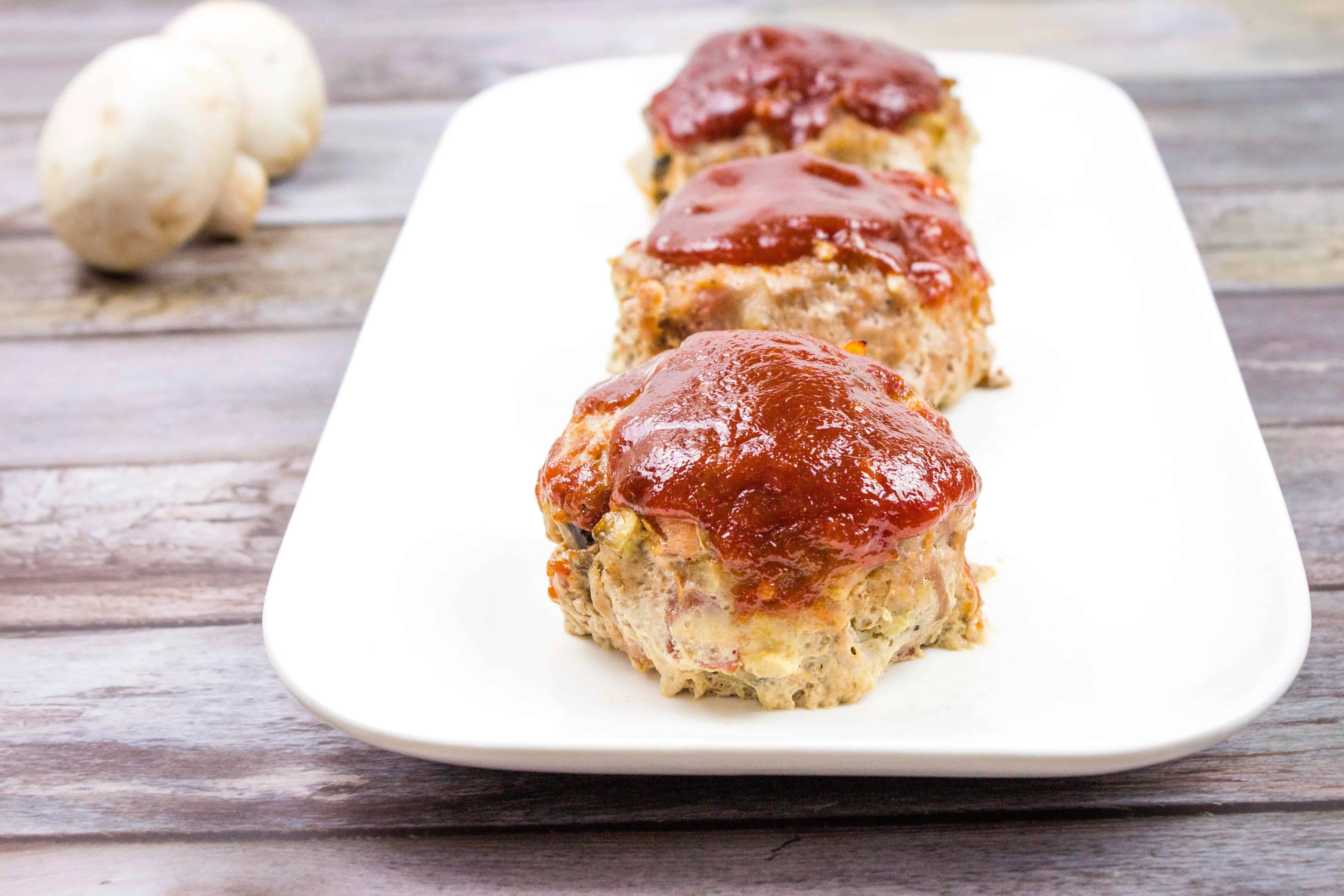 easy mini keto meatloaf on a white serving tray