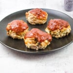the best mini keto meatloaf recipe on a black plate