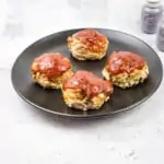 keto meatloaf muffins on a black plate