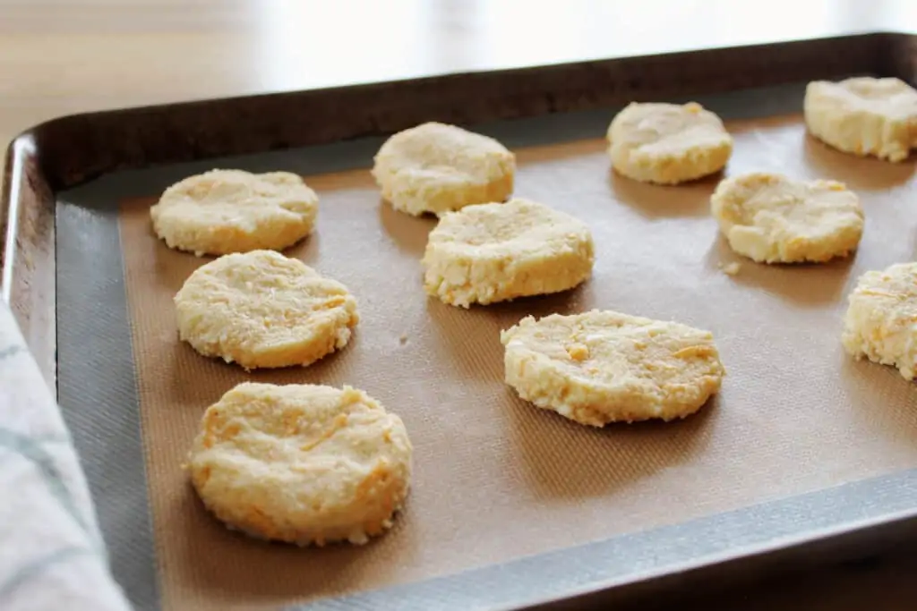 cut biscuit rounds on a lined sheet pan