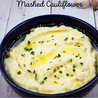 keto mashed cauliflower in a blue serving bowl