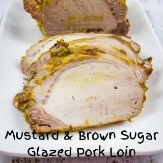 mustard & brown sugar glazed pork loin on a serving platter